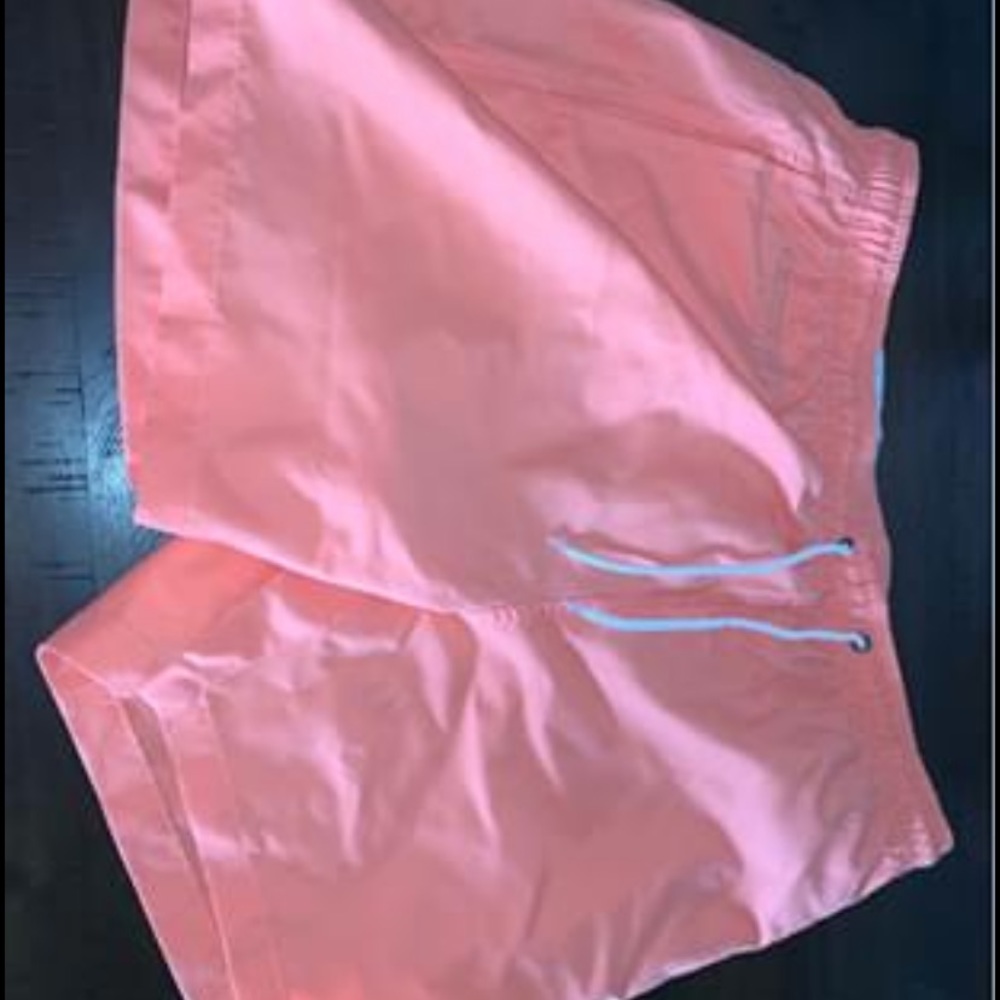 Men’s coral colored board shorts